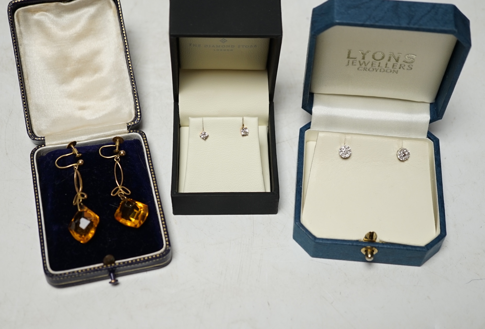 Three pairs of assorted earrings including small 18k and diamond cluster and small 9k and solitaire diamond. Condition - poor to fair